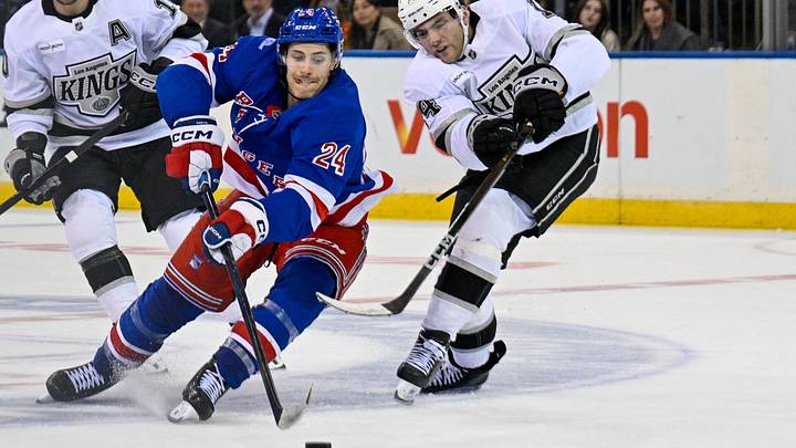 Oct 26, 2026; New York, New York, USA;  New York Rangers left wing Tye Kartye (24) makes a move around Los Angeles Kings right wing Alex Laferriere (14) during the third period at Madison Square Garden.  Mandatory Credit: Dennis Schneidler-Imagn Images
