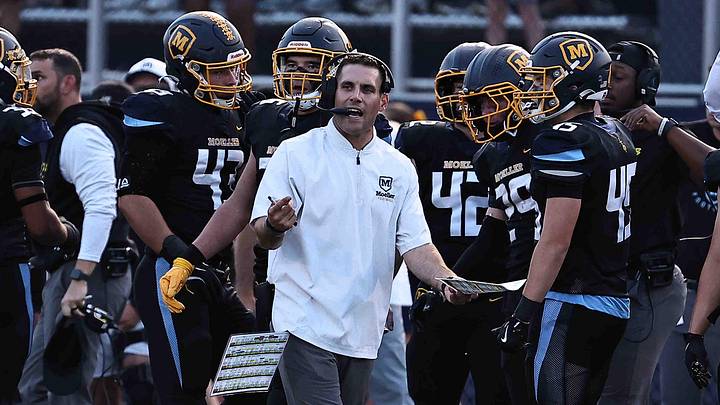 Moeller head coach Bert Bathiany reacts during their football game against St. Xavier Friday, Sept. 19, 2025. Moeller head coach Bert Bathiany reacts during their football game against St. Xavier Friday, Sept. 19, 2025.