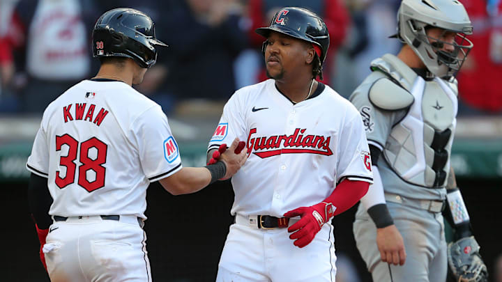 Cleveland Guardians third baseman Jose Ramirez (11) celebrates with Cleveland Guardians outfielder Steven Kwan (38) at home after his two-run homer during the fifth inning of the Cleveland Guardians' home opener against the Chicago White Sox, Monday, April 8, 2024, in Cleveland, Ohio.