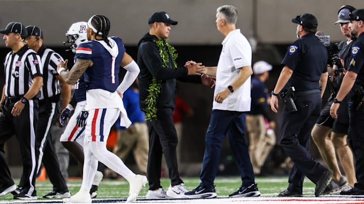 Aug 30, 2025; Tucson, Arizona, USA; Hawaii Rainbow Warriors head coach Timmy Chang shakes hands with Arizona Wildcats head coach Brent Brennan at the end of the game at Arizona Stadium. Mandatory Credit: Aryanna Frank-Imagn Images