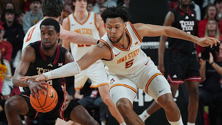 Iowa State Cyclones forward Joshua Jefferson (5) tries to steal the ball from Texas Tech Red Raiders guard Donovan Atwell (12) during the first half in the Big-12 conference men’s basketball against Texas Tech on Feb. 28, 2026, at Hilton Coliseum in Ames, Iowa.