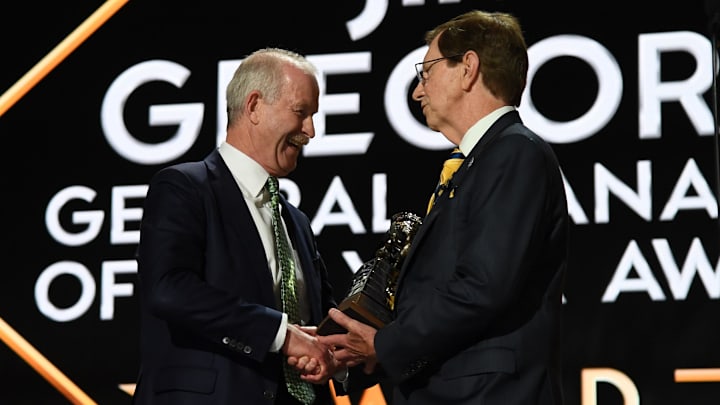 Jun 28, 2023; Nashville, Tennessee, USA; Dallas Stars general manager Jim Nill is awarded the Jim Gregory General Manager of the Year award by Nashville Predators general manager David Poile during the first round of the 2023 NHL Draft at Bridgestone Arena. Mandatory Credit: Christopher Hanewinckel-Imagn Images