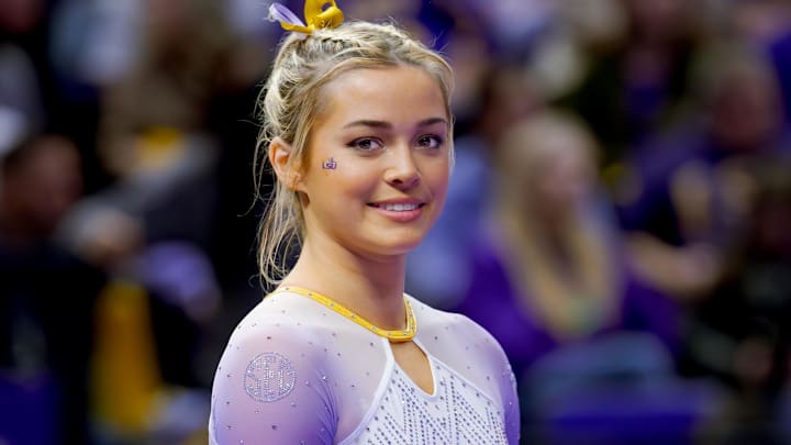 LSU Lady Tigers’ Livvy Dunne smiles before a floor routine against the Arkansas Razorbacks.