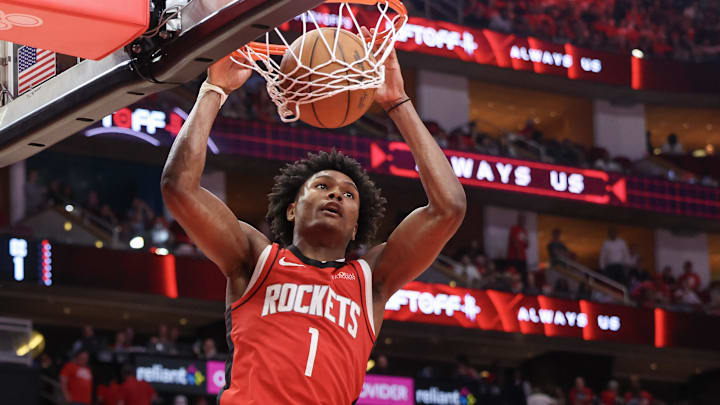 Apr 30, 2025; Houston, Texas, USA; Houston Rockets forward Amen Thompson (1) dunks against the Golden State Warriors in the fourth quarter during game five of the first round of the 2025 NBA Playoffs at Toyota Center.