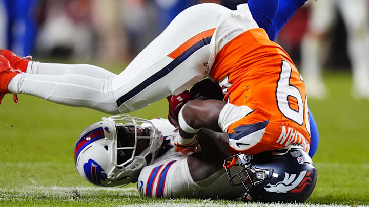 A controversial call on a contested catch between Brandin Cooks and Ja'Quan McMillian in overtime helped decide the Bills-Broncos playoff game. 