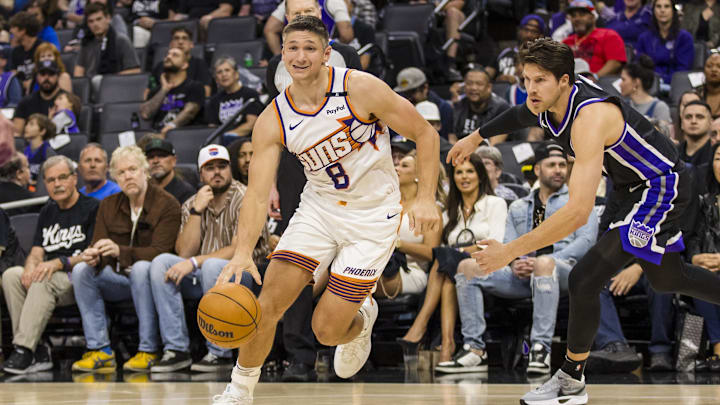 Apr 13, 2025; Sacramento, California, USA;  Phoenix Suns guard Grayson Allen (8) dribbles against the Sacramento Kings during the fourth quarter at Golden 1 Center. Mandatory Credit: John Hefti-Imagn Images