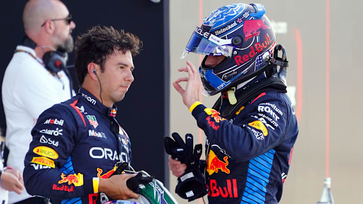 May 4, 2024; Miami Gardens, Florida, USA; Red Bull Racing driver Sergio Perez (11) and Red Bull Racing driver Max Verstappen (1) talks after Verstappen qualified P1 for the Miami Grand Prix at Miami International Autodrome. Mandatory Credit: John David Mercer-USA TODAY Sports