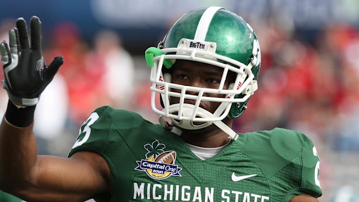 Jan 1, 2009; Orlando, FL, USA; Michigan State Spartans running back Javon Ringer (23) waves to the crowd pre-game against the Georgia Bulldogs at Florida Citrus Bowl Stadium. Mandatory Credit: Matthew Emmons-Imagn Images Jan 1, 2009; Orlando, FL, USA; Michigan State Spartans running back Javon Ringer (23) waves to the crowd pre-game against the Georgia Bulldogs at Florida Citrus Bowl Stadium. Mandatory Credit: Matthew Emmons-Imagn Images