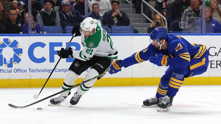 Dallas Stars left wing Jason Robertson (21) controls the puck as Buffalo Sabres defenseman Mattias Samuelsson (23) defends during the first period at KeyBank Center. Mandatory Credit: Timothy T. Ludwig-Imagn Images Dallas Stars left wing Jason Robertson (21) controls the puck as Buffalo Sabres defenseman Mattias Samuelsson (23) defends during the first period at KeyBank Center. Mandatory Credit: Timothy T. Ludwig-Imagn Images