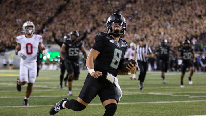 Oregon quarterback Dillon Gabriel scores a touchdown against Ohio State during the fourth quarter at Autzen Stadium Saturday, Oct. 12, 2024.