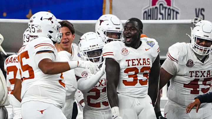 Texas Longhorns linebacker David Gbenda (33) celebrates an interception during the College Football Playoff semifinal game against Ohio State in the Cotton Bowl at AT&T Stadium on Friday, Jan. 10, 2024 in Arlington, Texas. Texas Longhorns linebacker David Gbenda (33) celebrates an interception during the College Football Playoff semifinal game against Ohio State in the Cotton Bowl at AT&T Stadium on Friday, Jan. 10, 2024 in Arlington, Texas.