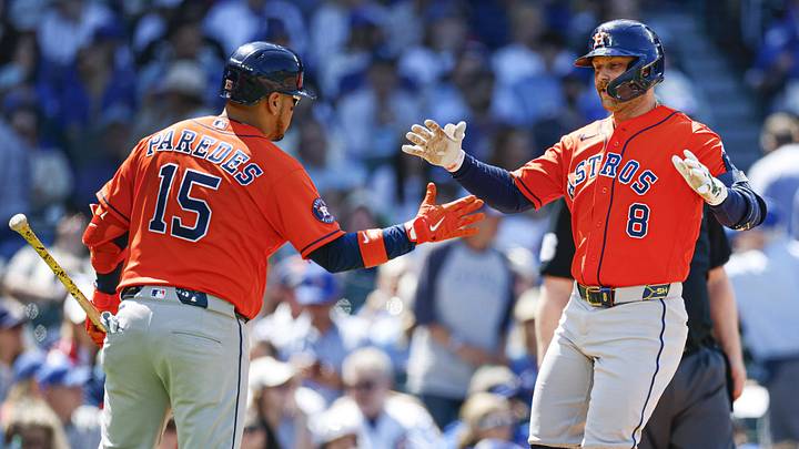 Houston Astros first baseman Christian Walker (8) celebrates with designated hitter Isaac Paredes (15) after hitting a three-run home run against the Chicago Cubs.