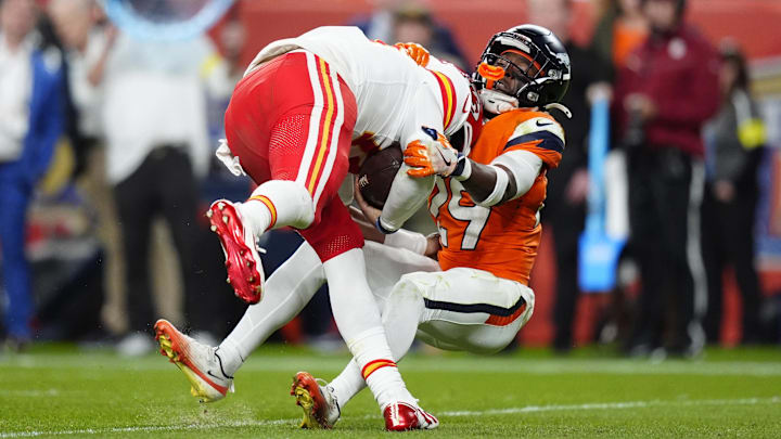 Nov 16, 2025; Denver, Colorado, USA; Denver Broncos cornerback Ja'Quan McMillian (29) sacks Kansas City Chiefs quarterback Patrick Mahomes (15) in the fourth quarter at Empower Field at Mile High. Mandatory Credit: Ron Chenoy-Imagn Images