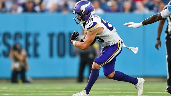 Aug 22, 2025; Nashville, Tennessee, USA;   Minnesota Vikings wide receiver Thayer Thomas (89) runs with the ball  against the Tennessee Titan during the first half at Nissan Stadium. Mandatory Credit: Steve Roberts-Imagn Images