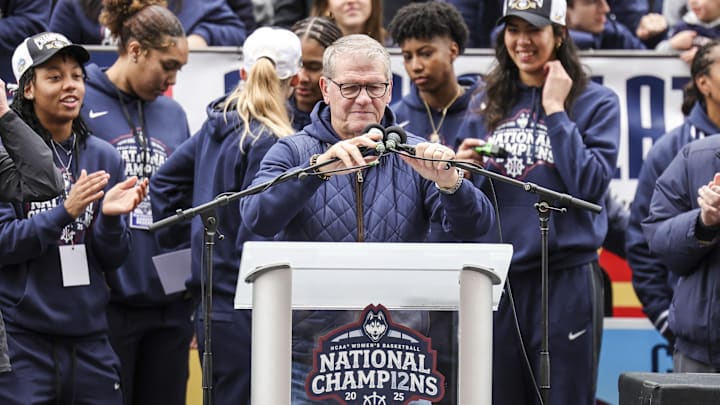 Apr 13, 2025; Hartford, CT, USA;   UConn Huskies head coach Geno Auriemma adjusts the microphones prior to his speech during the Final Four champions victory parade and rally outside of the XL Center in Hartford, CT. Mandatory Credit: Scott Rausenberger-Imagn Images