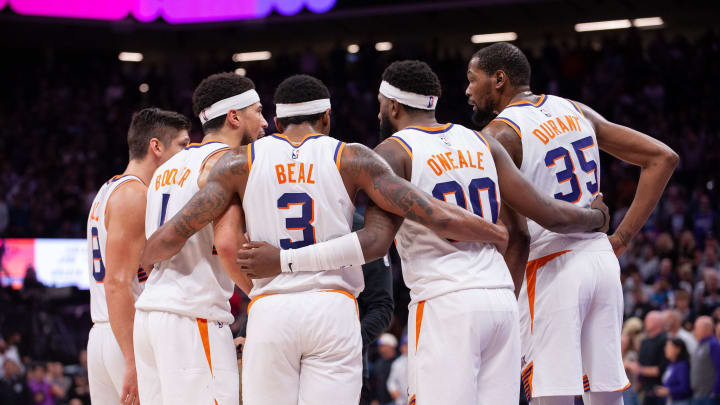Apr 12, 2024; Sacramento, California, USA; Phoenix Suns guard Grayson Allen (8) and guard Devin Booker (1) and guard Bradley Beal (3) and forward Royce O'Neale (00) and forward Kevin Durant (35) huddle up before the final seconds of the fourth quarter at Golden 1 Center. Mandatory Credit: Ed Szczepanski-USA TODAY Sports