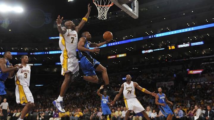 Orlando's Rafer Alston drives for a layup against Lakers Lamar Odom with Kobe Bryant looking on during Game 2 of the 2009 NBA Finals at the Staples Center in Los Angeles. 