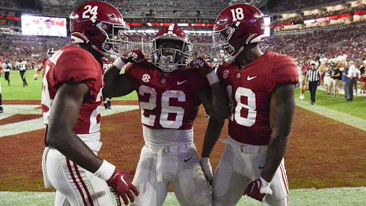 Sep 24, 2022; Tuscaloosa, Alabama, USA;  Alabama Crimson Tide running back Jamarion Miller (26) celebrates with wide receiver/running back Emmanuel Henderson Jr. (24) and wide receiver Shazz Preston (18) after scoring a touchdown against the Vanderbilt Commodores at Bryant-Denny Stadium. Alabama won 55-3. Mandatory Credit: Gary Cosby Jr.-Imagn Images