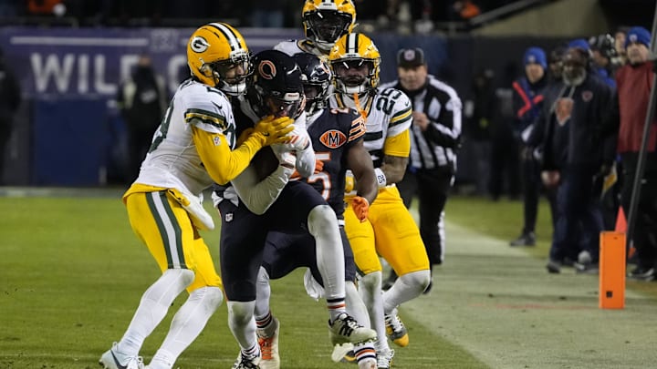 Jan 10, 2026; Chicago, IL, USA;  Chicago Bears wide receiver Rome Odunze (15) runs after the catch as Green Bay Packers safety Xavier McKinney (29) defends during the second half of an NFC Wild Card Round game at Soldier Field. Mandatory Credit: David Banks-Imagn Images
