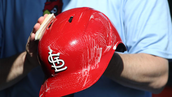 Apr 9, 2025; Pittsburgh, Pennsylvania, USA;  The St. Louis Cardinals equipment manger scrubs the team batting helmets before the game against the Pittsburgh Pirates at PNC Park. Mandatory Credit: Charles LeClaire-Imagn Images