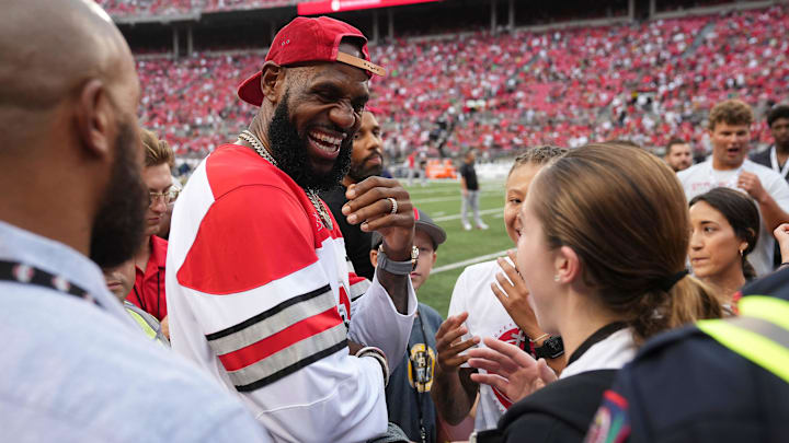 LeBron James talks to fans prior to the NCAA football game between the Ohio State Buckeyes and Notre Dame Fighting Irish at Ohio Stadium. LeBron James talks to fans prior to the NCAA football game between the Ohio State Buckeyes and Notre Dame Fighting Irish at Ohio Stadium.