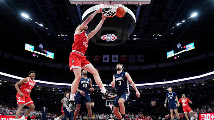 Ohio State Buckeyes center Ivan Njegovan (7) dunks over Penn State Nittany Lions forward Ivan Juric (3) during the second half of the NCAA men's basketball game at the Schottenstein Center in Columbus on Jan. 26, 2026. Ohio State won 84-78.
