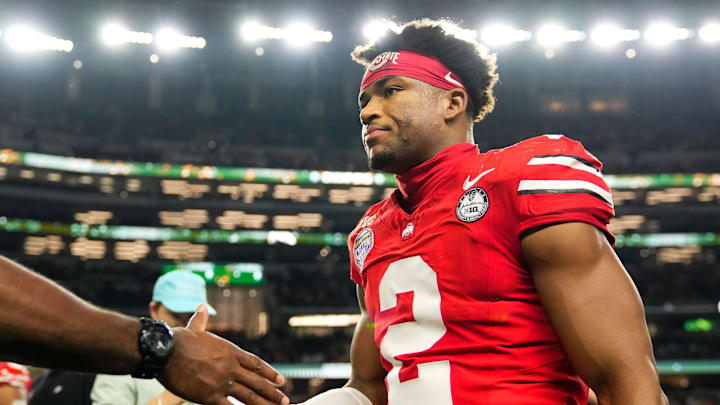 Ohio State Buckeyes defensive back Caleb Downs leaves the field following the Cotton Bowl at AT&T Stadium 