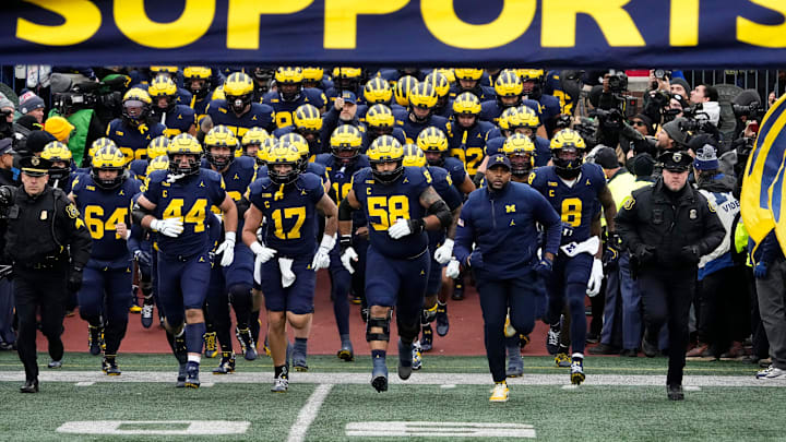 Michigan Wolverines head coach Sherrone Moore leads his team onto the field for the NCAA football game against the Ohio State Buckeyes at Michigan Stadium in Ann Arbor, Mich. on Nov. 29, 2025. Ohio State won 27-9.