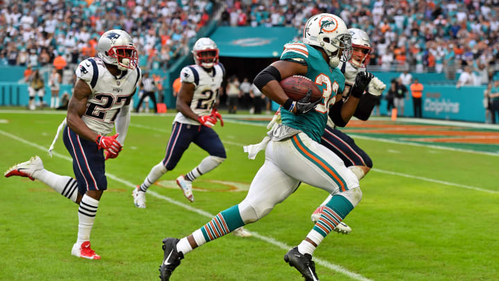 Miami Dolphins running back Kenyan Drake (32) heads for the walk-off touchdown against the New England Patriots in the "Miami Miracle" at Hard Rock Stadium. Mandatory in 2018.