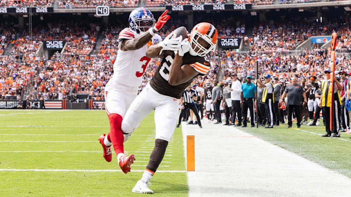Sep 22, 2024; Cleveland, Ohio, USA; Cleveland Browns wide receiver Amari Cooper (2) makes a touchdown reception under coverage by New York Giants cornerback Deonte Banks (3) during the first quarter at Huntington Bank Field. Mandatory Credit: Scott Galvin-Imagn Images