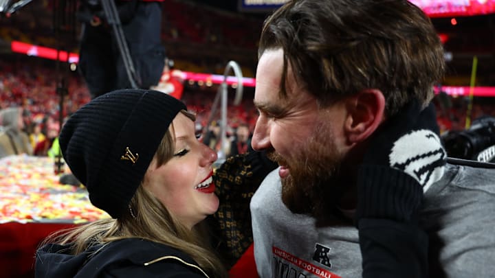 Jan 26, 2025; Recording artist Taylor Swift and Kansas City Chiefs tight end Travis Kelce (87) react after the AFC Championship game against the Buffalo Bills at GEHA Field at Arrowhead Stadium. Jan 26, 2025; Recording artist Taylor Swift and Kansas City Chiefs tight end Travis Kelce (87) react after the AFC Championship game against the Buffalo Bills at GEHA Field at Arrowhead Stadium.