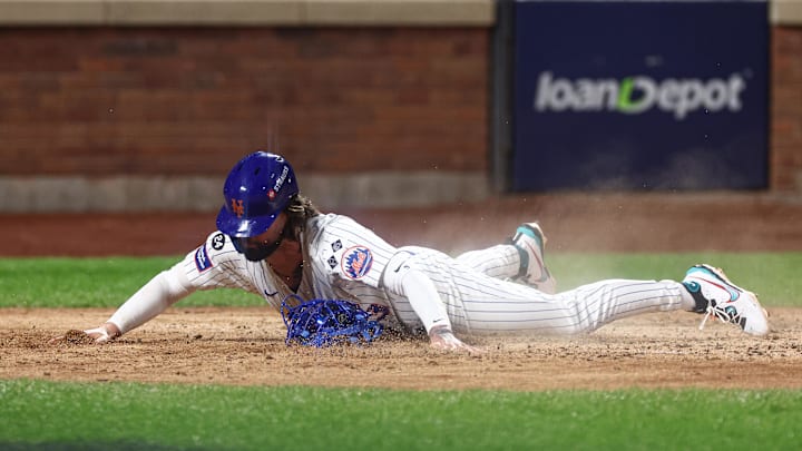 Oct 18, 2024; New York City, New York, USA; New York Mets left fielder Jesse Winker (3) scores a run during the sixth inning against the Los Angeles Dodgers during game five of the NLCS for the 2024 MLB playoffs at Citi Field. Mandatory Credit: Vincent Carchietta-Imagn Images