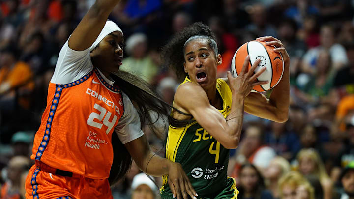 Jul 28, 2025; Uncasville, Connecticut, USA; Seattle Storm guard Skylar Diggins (4) drives the ball against Connecticut Sun forward Aneesah Morrow (24) in the first half at Mohegan Sun Arena. 
