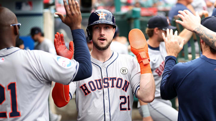 Sep 15, 2024; Anaheim, California, USA;  Houston Astros right fielder Kyle Tucker (21) is greeted in the dugout after scoring a run during the fourth inning against the Los Angeles Angels at Angel Stadium.