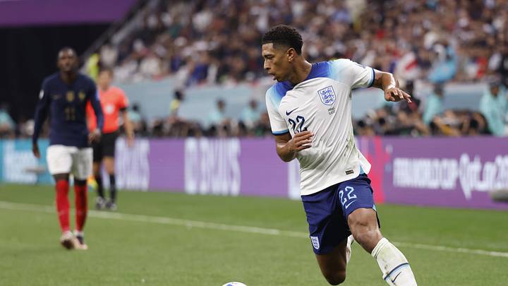 Dec 10, 2022; Al Khor, Qatar; England midfielder Jude Bellingham (22) dribbles during the first half of a quarterfinal game against France in the 2022 FIFA World Cup at Al-Bayt Stadium. Mandatory Credit: Yukihito Taguchi-Imagn Images
