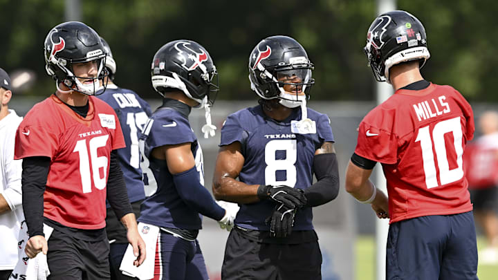 Jun 10, 2025; Houston, TX, USA; Houston Texans wide receiver John Metchie III (8) speaks with quarterback Davis Mills (10) during an NFL football minicamp at NRG Stadium. Mandatory Credit: Maria Lysaker-Imagn Images Jun 10, 2025; Houston, TX, USA; Houston Texans wide receiver John Metchie III (8) speaks with quarterback Davis Mills (10) during an NFL football minicamp at NRG Stadium. Mandatory Credit: Maria Lysaker-Imagn Images