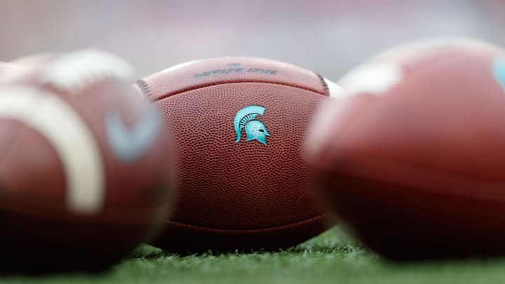 Oct 12, 2019; Madison, WI, USA; Michigan State Spartans logo on footballs during warmups prior to Oct 12, 2019; Madison, WI, USA; Michigan State Spartans logo on footballs during warmups prior to