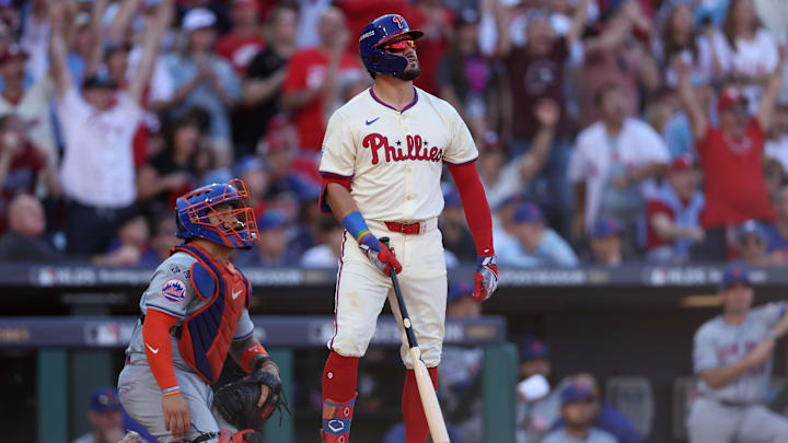 Oct 5, 2024; Philadelphia, PA, USA; Philadelphia Phillies designated hitter Kyle Schwarber (12) hits a solo home run against the New York Mets in the first inning in game one of the NLDS for the 2024 MLB Playoffs at Citizens Bank Park. 