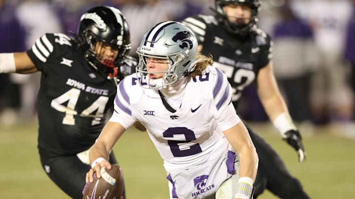 Nov 30, 2024; Ames, Iowa, USA;  Kansas State Wildcats quarterback Avery Johnson (2) is pressured by Iowa State Cyclones linebacker Jacob Ellis (44)  in the fourth quarter at Jack Trice Stadium. Mandatory Credit: Reese Strickland-Imagn Images