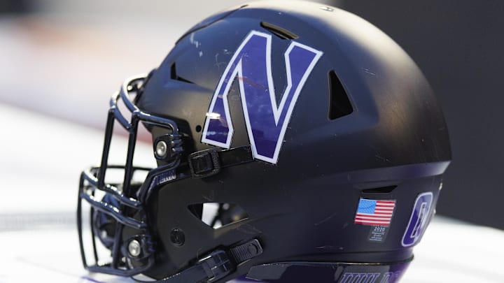 Nov 11, 2023; Madison, Wisconsin, USA;  General view of a Northwestern Wildcats helmet on the sidelines during the game against the Wisconsin Badgers at Camp Randall Stadium. Mandatory Credit: Jeff Hanisch-Imagn Images