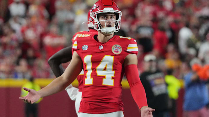 Sep 5, 2024; Kansas City, Missouri, USA; Kansas City Chiefs punter Matt Araiza (14) reacts while watching a replay against the Baltimore Ravens during the game at GEHA Field at Arrowhead Stadium. Mandatory Credit: Denny Medley-Imagn Images