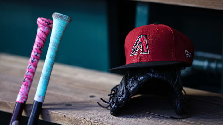 Jun 7, 2023; Washington, District of Columbia, USA; A general view of an Arizona Diamondbacks hat, glove, and bats in the dugout during the fifth inning of the game against the Washington Nationals at Nationals Park. Mandatory Credit: Scott Taetsch-Imagn Images Jun 7, 2023; Washington, District of Columbia, USA; A general view of an Arizona Diamondbacks hat, glove, and bats in the dugout during the fifth inning of the game against the Washington Nationals at Nationals Park. Mandatory Credit: Scott Taetsch-Imagn Images