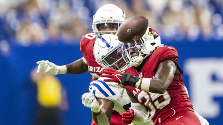 Aug 17, 2024; Indianapolis, Indiana, USA; Indianapolis Colts tight end Jordan Murray (84) looks at a ball that is just too far to catch behind Arizona Cardinals safety Verone McKinley III (35) during the second half at Lucas Oil Stadium.  