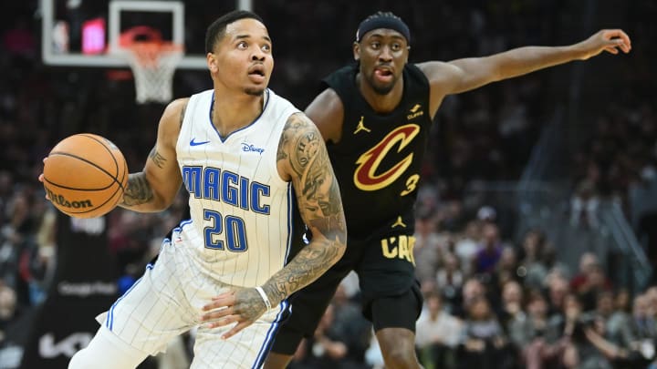 Apr 30, 2024; Cleveland, Ohio, USA; Orlando Magic guard Markelle Fultz (20) drives to the basket against Cleveland Cavaliers guard Caris LeVert (3) during the first half in game five of the first round for the 2024 NBA playoffs at Rocket Mortgage FieldHouse. Apr 30, 2024; Cleveland, Ohio, USA; Orlando Magic guard Markelle Fultz (20) drives to the basket against Cleveland Cavaliers guard Caris LeVert (3) during the first half in game five of the first round for the 2024 NBA playoffs at Rocket Mortgage FieldHouse.