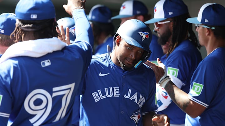 Feb 27, 2025: Toronto Blue Jays second base Orelvis Martinez (13) scores a run during the fourth inning against the Baltimore Orioles  at Ed Smith Stadium.