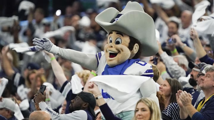 Dec 11, 2022; Arlington, Texas, USA; Dallas Cowboys mascot Rowdy with fans in the stands at kickoff