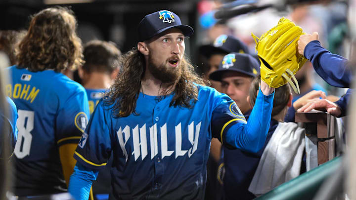 Aug 22, 2025; Philadelphia, Pennsylvania, USA; Philadelphia Phillies pitcher Matt Strahm (25) is greeted by teammates in the dugout after the seventh inning against the Washington Nationals at Citizens Bank Park. Mandatory Credit: John Jones-Imagn Images