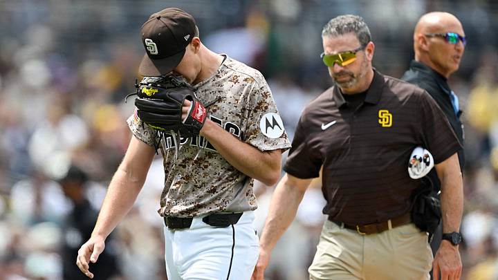 Apr 12, 2026; San Diego, California, USA; San Diego Padres starting pitcher Nick Pivetta (27), left, leaves the field with a trainer during the fourth inning against the Colorado Rockies at Petco Park. Mandatory Credit: Denis Poroy-Imagn Images Apr 12, 2026; San Diego, California, USA; San Diego Padres starting pitcher Nick Pivetta (27), left, leaves the field with a trainer during the fourth inning against the Colorado Rockies at Petco Park. Mandatory Credit: Denis Poroy-Imagn Images