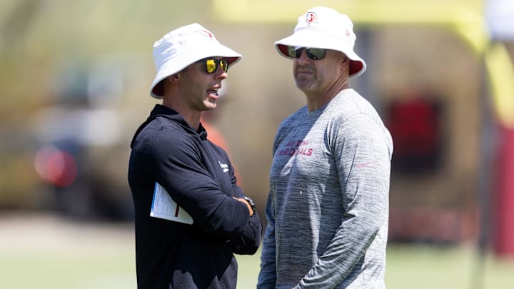 Jun 10, 2025; Tempe, AZ, USA; Arizona Cardinals head coach Jonathan Gannon (left) with general manager Monti Ossenfort during minicamp at the teams Arizona Cardinals Training Facility. Mandatory Credit: Mark J. Rebilas-Imagn Images