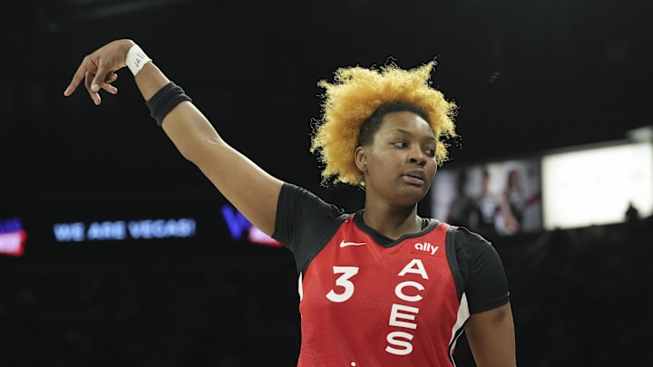 Aug 17, 2025; Las Vegas, Nevada, USA; Las Vegas Aces forward NaLyssa Smith (3) reacts to hitting a 3-pointer against the Dallas Wings in the fourth quarter of their game at Michelob Ultra Arena. Mandatory Credit: Candice Ward-Imagn Images